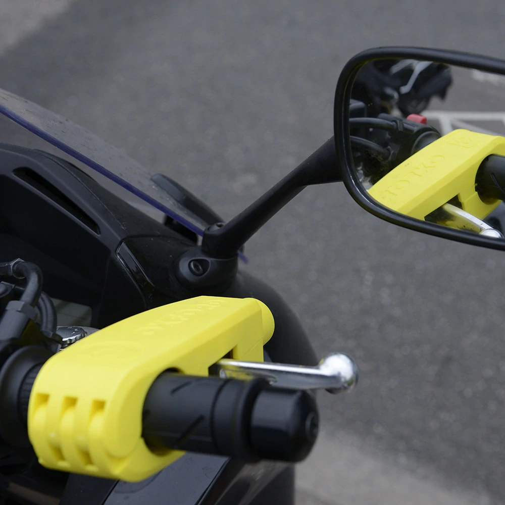 Zámek páčky přední brzdy motocyklu  OXFORD LEVERLOCK LK301 barva žlutá, pro průměr gripů od 28 do 38 mm